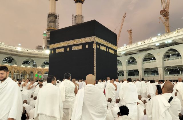 Pilgrims dressed in white gather around the Kaaba in Mecca's Grand Mosque, Saudi Arabia.