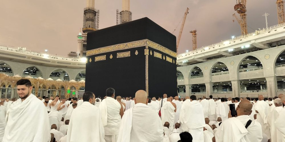 Pilgrims dressed in white gather around the Kaaba in Mecca's Grand Mosque, Saudi Arabia.